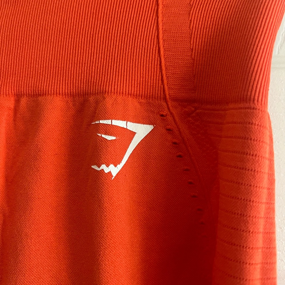 Barely worn Gymshark leggings, bright orange in size Large!